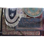 A collection of seven thick weave rugs to include Chinese wool rugs and others