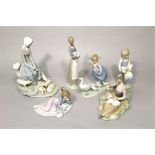 A collection of five Lladro Daisa figures including boxed girl with lamb 4505 and boxed Playful