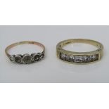 Two 9ct rings; one channel set with cubic zirconia, the other set with five graduating white stones,