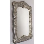 White metal easel mirror (no hallmarks present) decorated with scrolled acanthus and flowers, 27