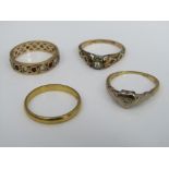 A 22ct wedding ring - 2g, together with three further rings including an 18ct example of heart