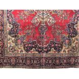 Good large Persian Tabriz carpet decorated with various floral sprays and navy blue medallions