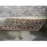 A reclaimed oak frieze of rectangular form with canted/angled ends and decorative pierced carved and
