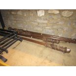 Four Victorian style wooden curtain poles of varying length with turned finials, together with a