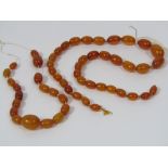 A quantity of graduated amber beads, 22g total