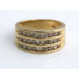 An 18ct diamond ring set in three rows, size N, 8g