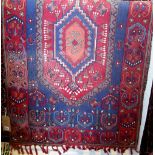 Indian crewel work panel with various geometric floral patterns upon a blue ground with red