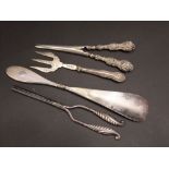Four silver handled items to include a show horn, glove stretchers, toasting fork and curling