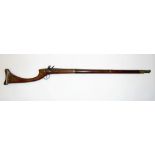 A Turkish flintlock rifle in rosewood with applied brass detail