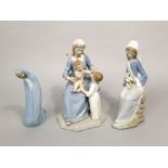 Two boxed Lladro Daisa groups, Bless The Child and Girl With Lilies Sitting, together with a further