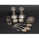 A mixed collection of silver to include a pair of silver candlesticks (AF) two napkin rings, two