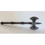 A wrought iron battle axe with fleur de lys roundel's and floral trails, 53cm long