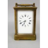 Good brass cased carriage clock, the square enamelled dial with Roman numerals, with repeater