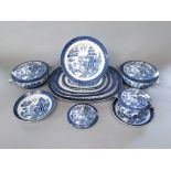 A collection of early 20th century Minton's blue and white Willow pattern dinner wares comprising