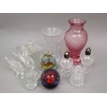 A mixed lot of glassware to include paperweights, vases, etc