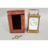 Gilt brass carriage clock with corniche case square enamelled dial with Roman numerals within a