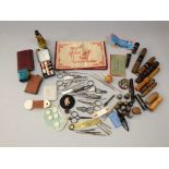 A collection of Victorian and later sewing effects, needle cases, cottons, embroidered pouch showing