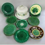 A collection of 19th century majolica plates including examples with medieval style female character