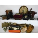 Two boxes of interesting items to include fire irons, Bakelite telephones, boot stretchers,