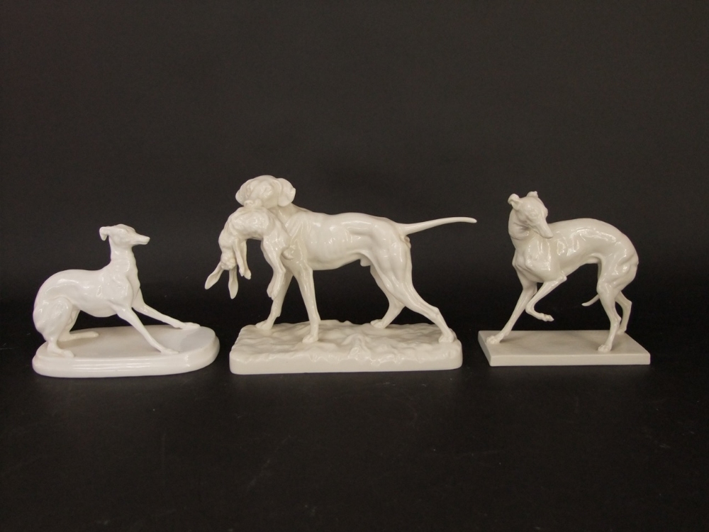 A collection of continental and other white glazed models of dogs including a Nymphenburg group of a - Image 2 of 5