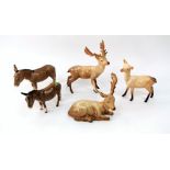 A collection of Beswick animals including a recumbent stag, a standing stag, a standing doe, a