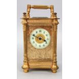 Pretty gilt cased carriage clock with cast pilasters and bevelled glass, the enamelled chapter