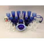 Mixed collection of glassware to include mainly blue glass vessels and glasses, together with a