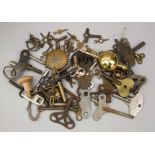 Collection of clock and watch keys, together with a few pendulums