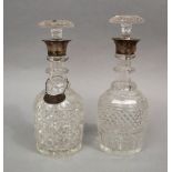 Two similar silver collared cut glass decanters, one with a silver whisky decanter label (2)