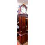 A regency mahogany long case clock, the trunk with flamed veneer within reeded and canted corner,