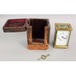 Gilt brass carriage clock with square enamelled dial fitted with Roman numerals within a Morocco