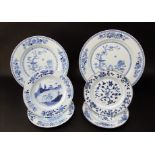 Two 19th century Chinese graduated blue and white chargers with painted bird and flowering tree