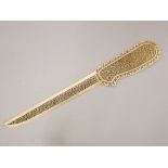 A 19th century Indian ivory paper or letter knife with heavily pierced geometric detail