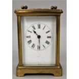 Brass cased carriage clock, with square enamelled dial and Roman numerals with fitted winder, 11