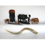 Mixed tribal lot to include a carved figural group of a water buffalo and a tribesmen together