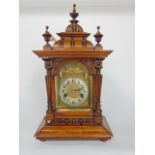 German HAC two train mantle clock, the architectural case fitted with a gilt arched dial, silvered