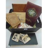 A box containing six cigarette card albums and further loose cigarette cards, together with two