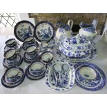 A collection of 19th century and other blue and white printed dinner wares including a Spode jug