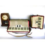 Large cased Hohner accordion; together with a further smaller example and a two train drop dial