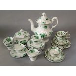 A collection of mid 19th century tea and coffee wares comprising a coffee pot with painted green