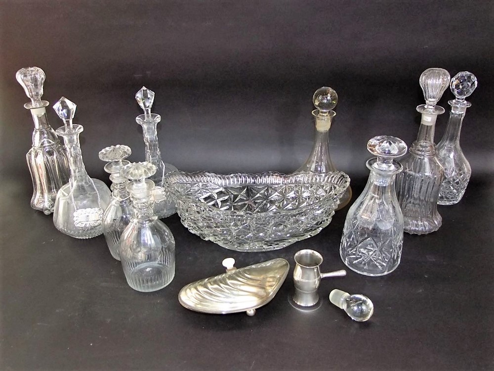 A mixed collection of glassware to include a cut and pressed glass lidded decanter, a fruit bowl and