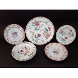 A collection of late 18th and early 19th century oriental plates and dishes including polychrome