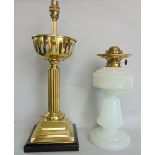 A polished brass lamp with fluted column and square stepped base together with a milk glass oil