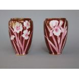 A pair of Royal Doulton red ground vases with Narcissi decoration, with printed mark to base and