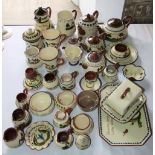 A quantity of Torquay wares including teapot, hot water jug, rectangular tray, cheese dish and