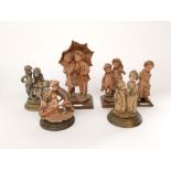 A collection of six Italian terracotta style figures by G Armani, all in the form of children