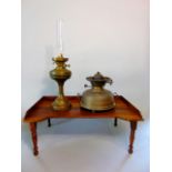 Two various brass oil lamps together with a wooden bed tray with folding legs (3)