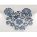 A quantity of blue ground Wedgwood Jasper wares including trinket boxes and covers, oval tray,