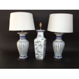 A pair of table lamp bases with crackle glaze finish and oriental blue character decoration, 33cm