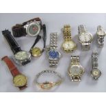 A collection of vintage watches to include a vintage rolled gold watch, a more recent Fossil